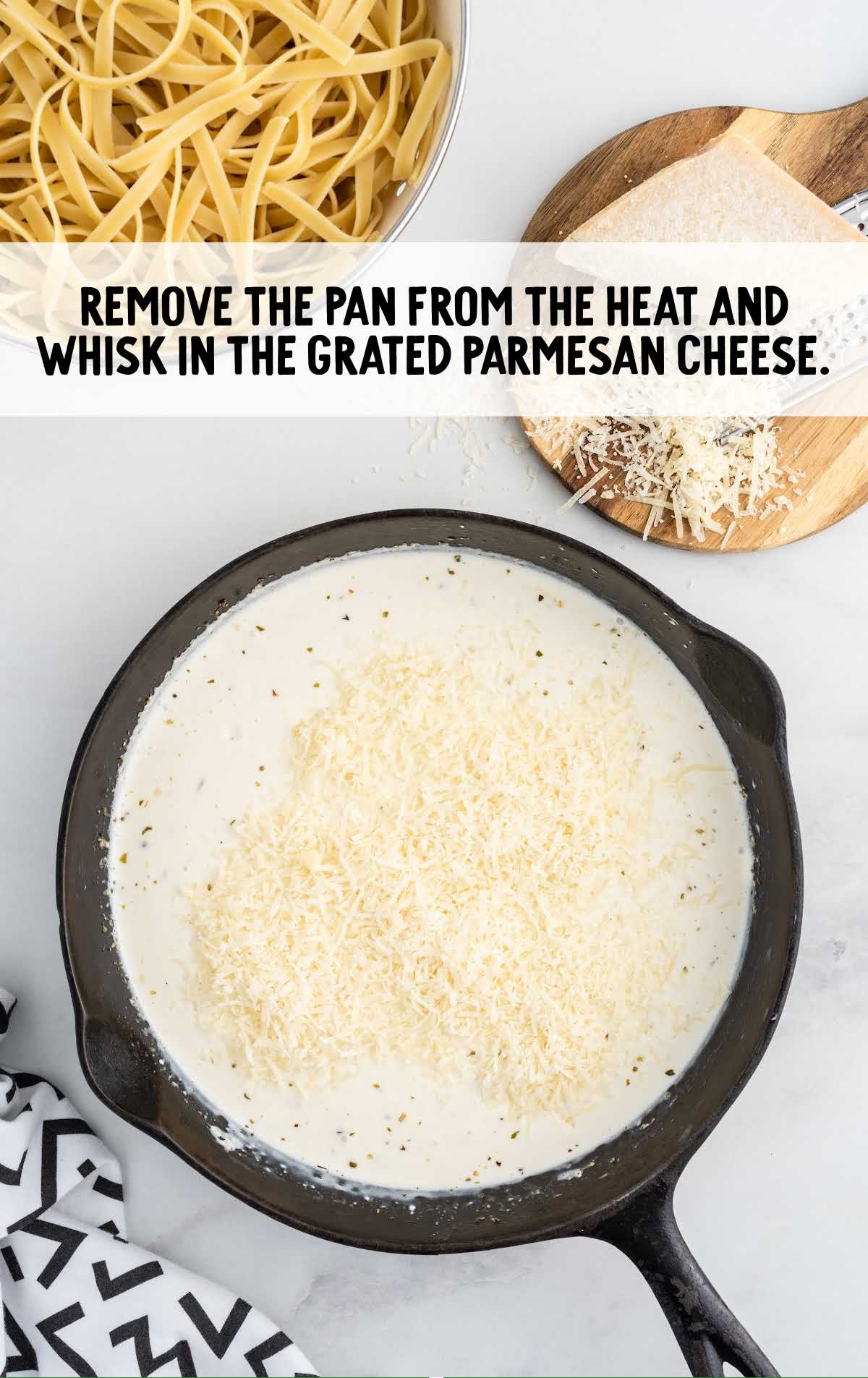 parmesan cheese added to the pepper mixture and whisked in a pan