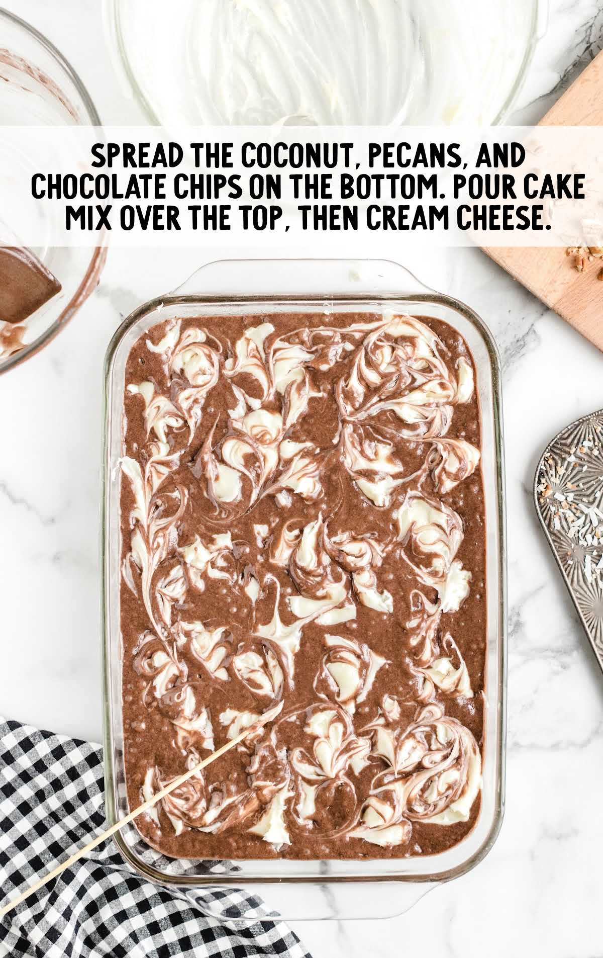 coconut, pecan, and chocolate chip spread to the bottom of the pan and pour cake mix on top and then cream cheese