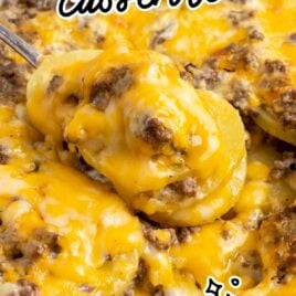 a close up shot of Hamburger Potato Casserole in a baking dish with a piece taken out with a spoon