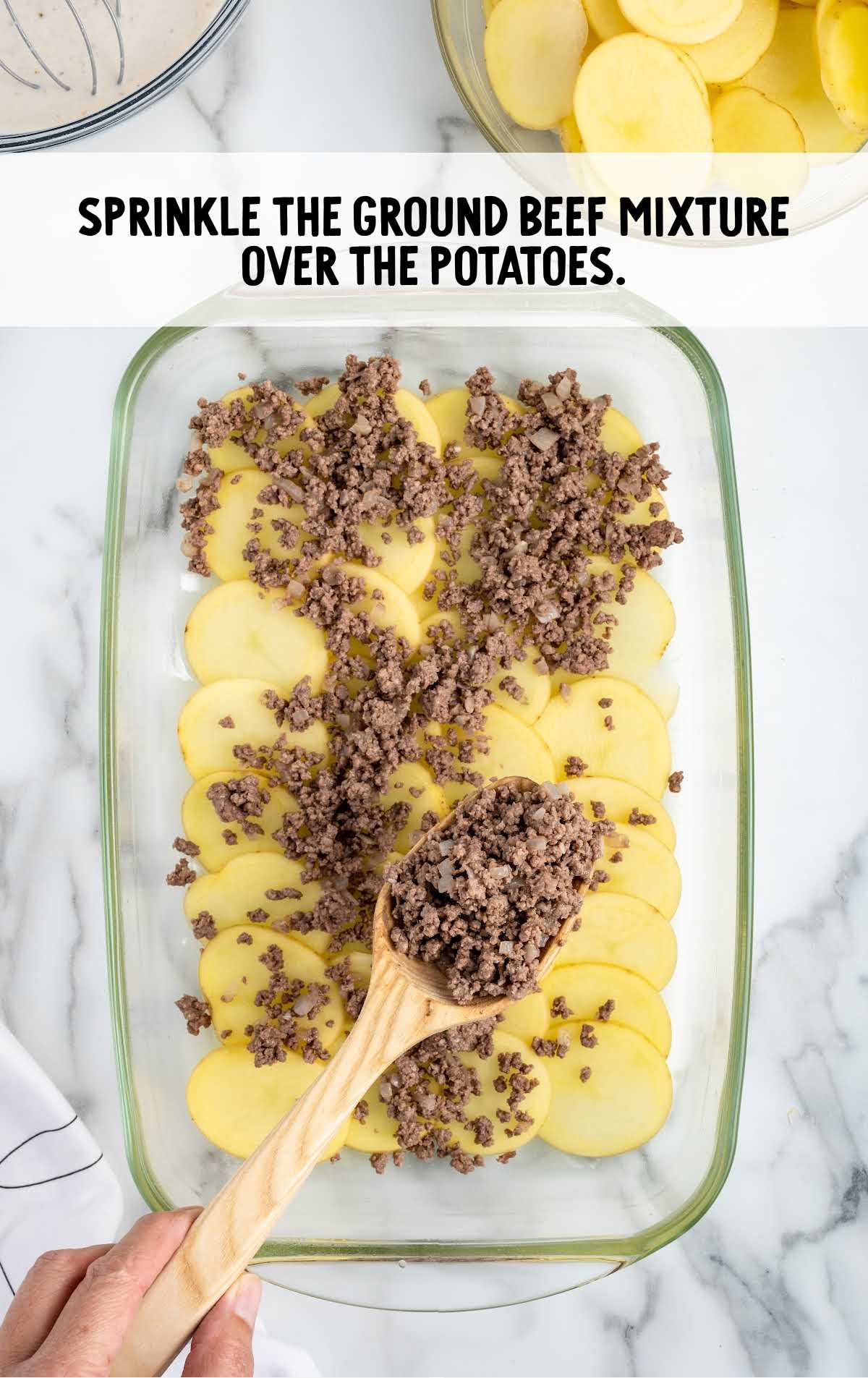 ground beef mixture sprinkled over the potatoes