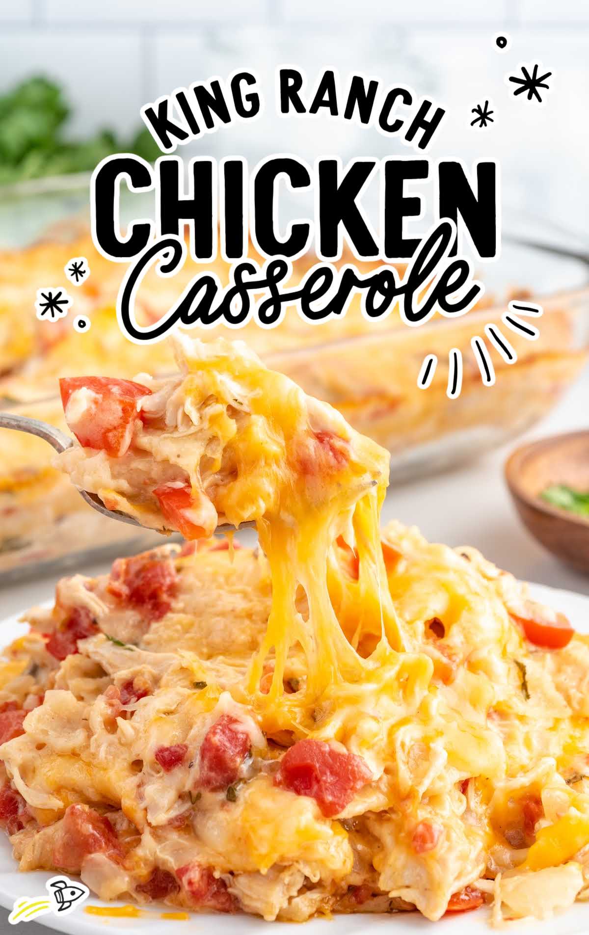 a close up shot of King Ranch Chicken Casserole on a plate with a fork grabbing a piece