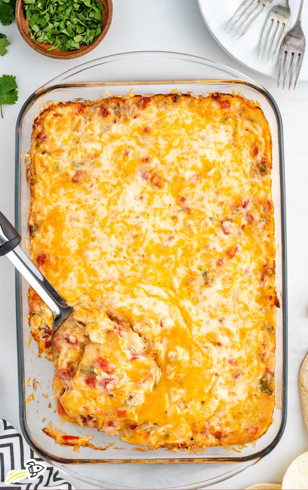 a close up shot of King Ranch Chicken Casserole with a spatula grabbing a piece