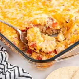 a close up shot of King Ranch Chicken Casserole with a fork grabbing a piece