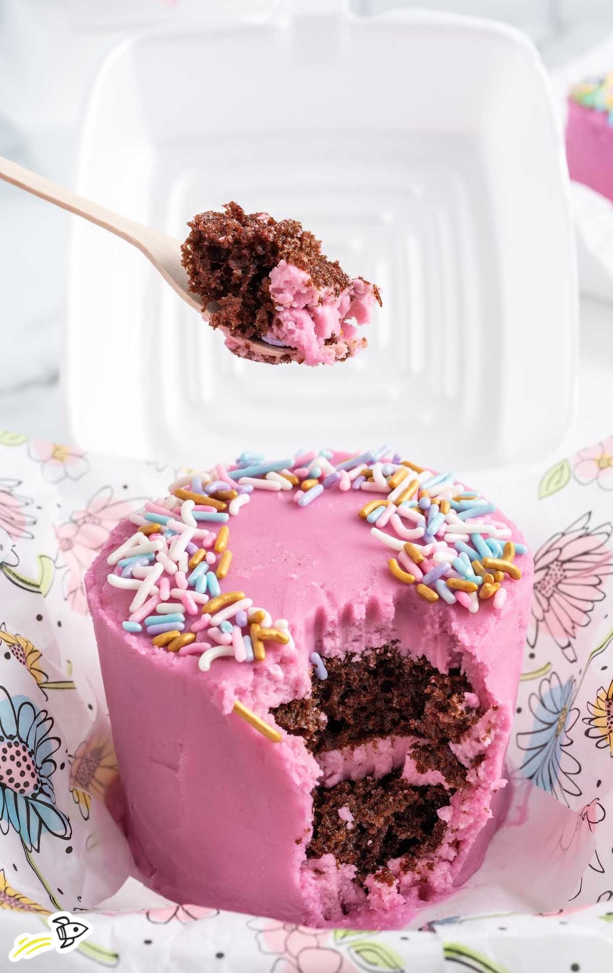 a close up shot of Lunch Box Cake with a spoon grabbing a piece