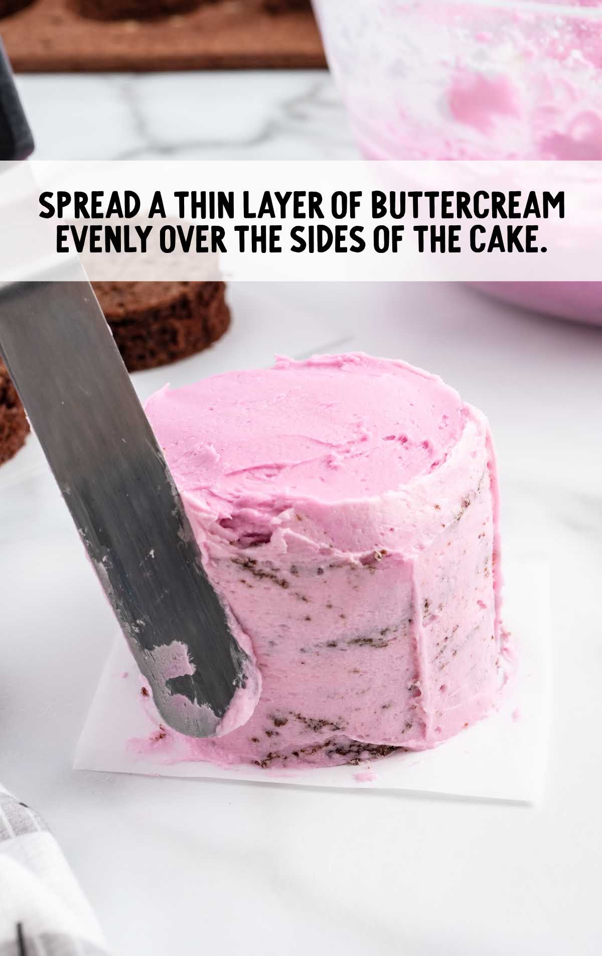 buttercream spread on the sides of the cake