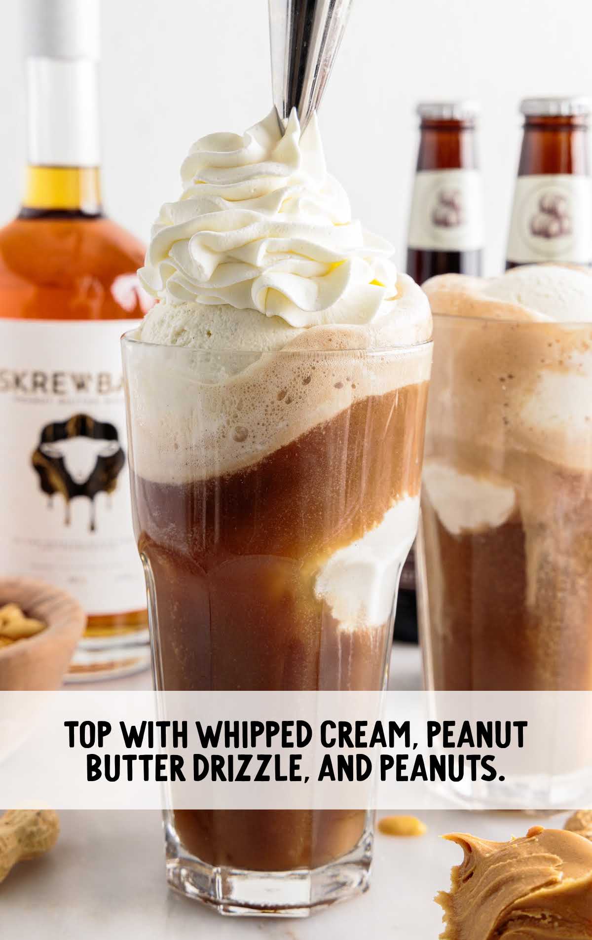whipped cream, peanut butter drizzled and peanut topped on the butter root beer