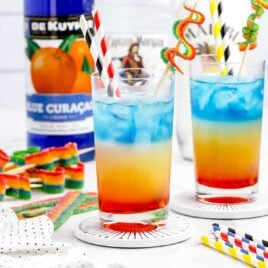 a close up shot of a couple of Rainbow Cocktail