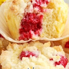 a close up shot of Raspberry Lemon Muffins with one having a bite taken out if it