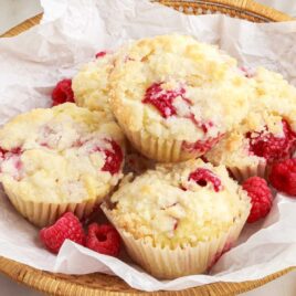 a close up shot of Raspberry Lemon Muffins in a basket