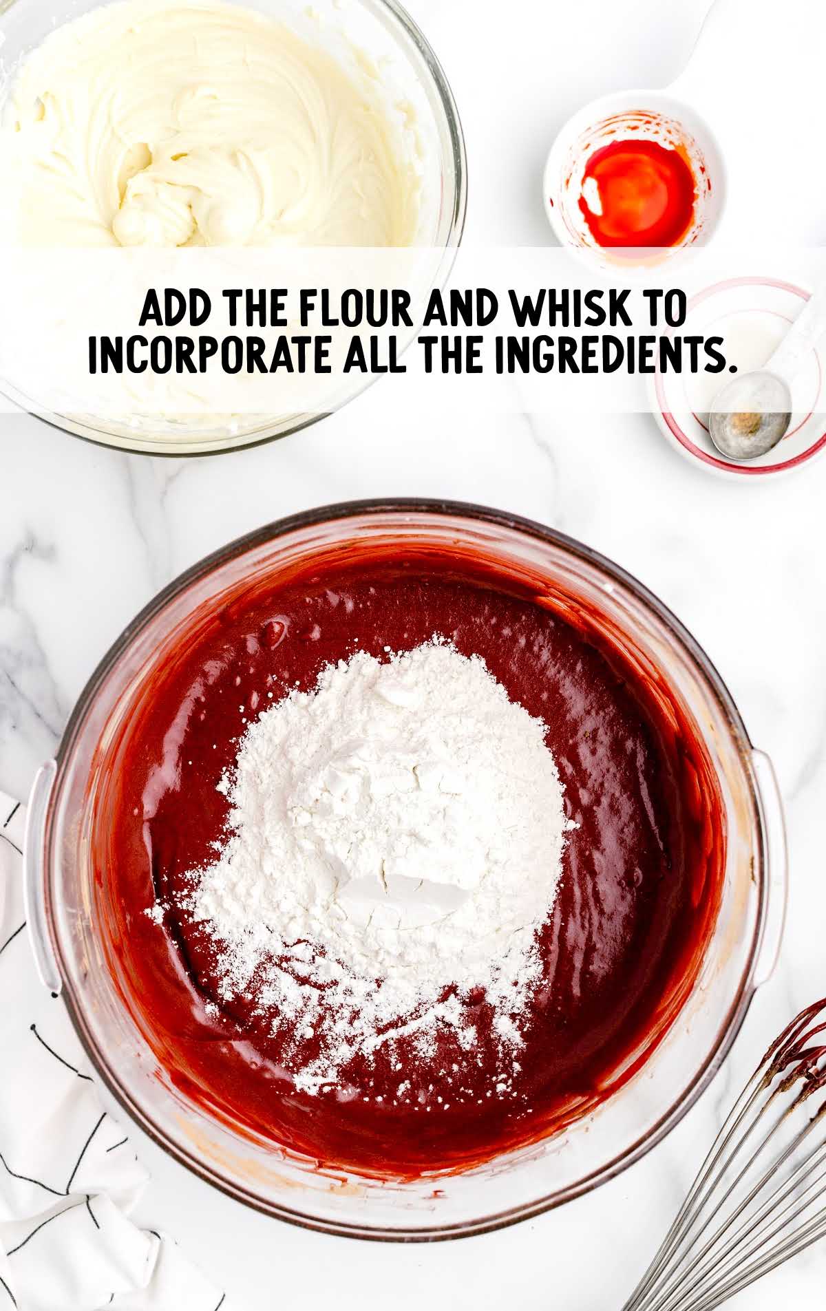 flour added incorporated with all the ingredients and whisked in a bowl