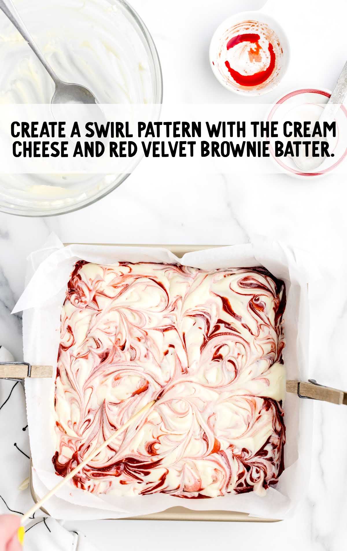 swirl patterns created with the cream cheese and red velvet brownie batter