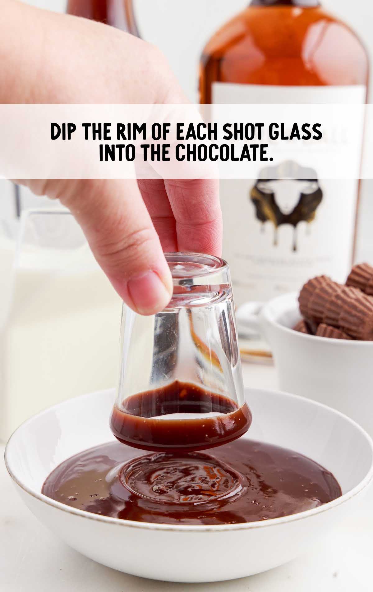 shot glass rim dipped in to the melted chocolate