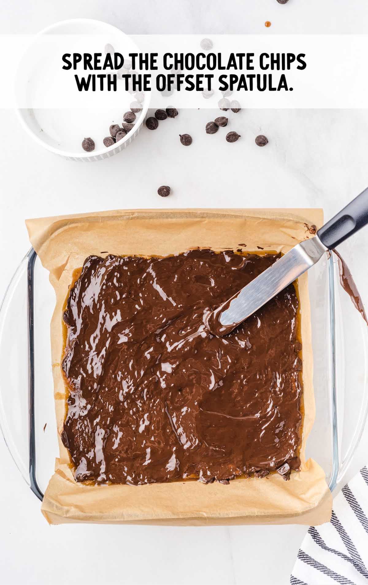 chocolate chips spread with offset spatula