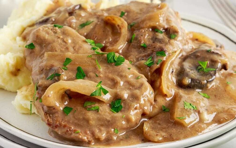 a close up shot of Slow Cooker Cube Steak on a plate