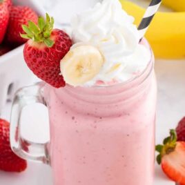 a close up shot of Strawberry Banana Smoothie in a mug