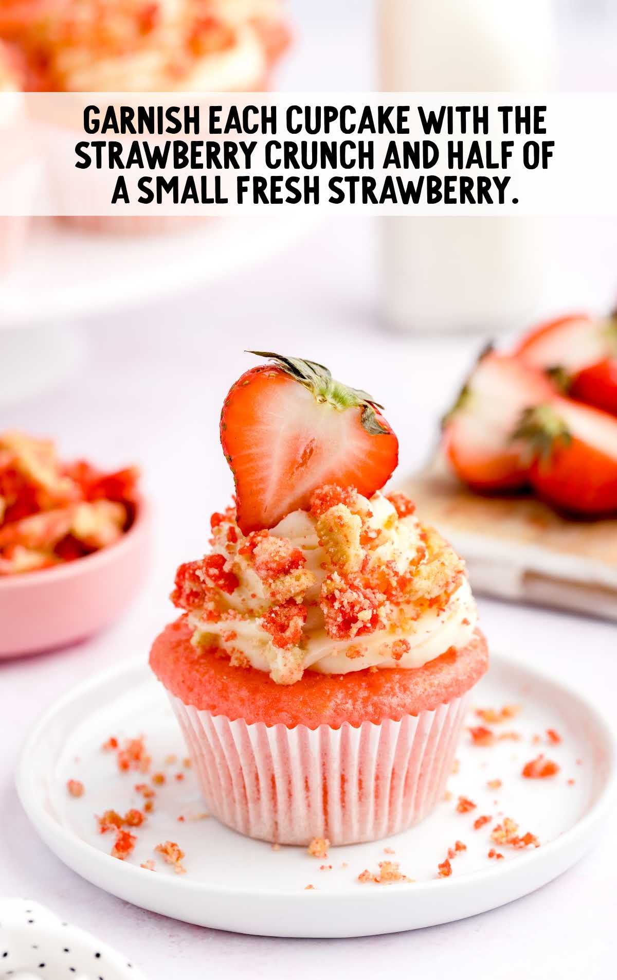 garnish cupcake with strawberry crunch and half and half strawberry