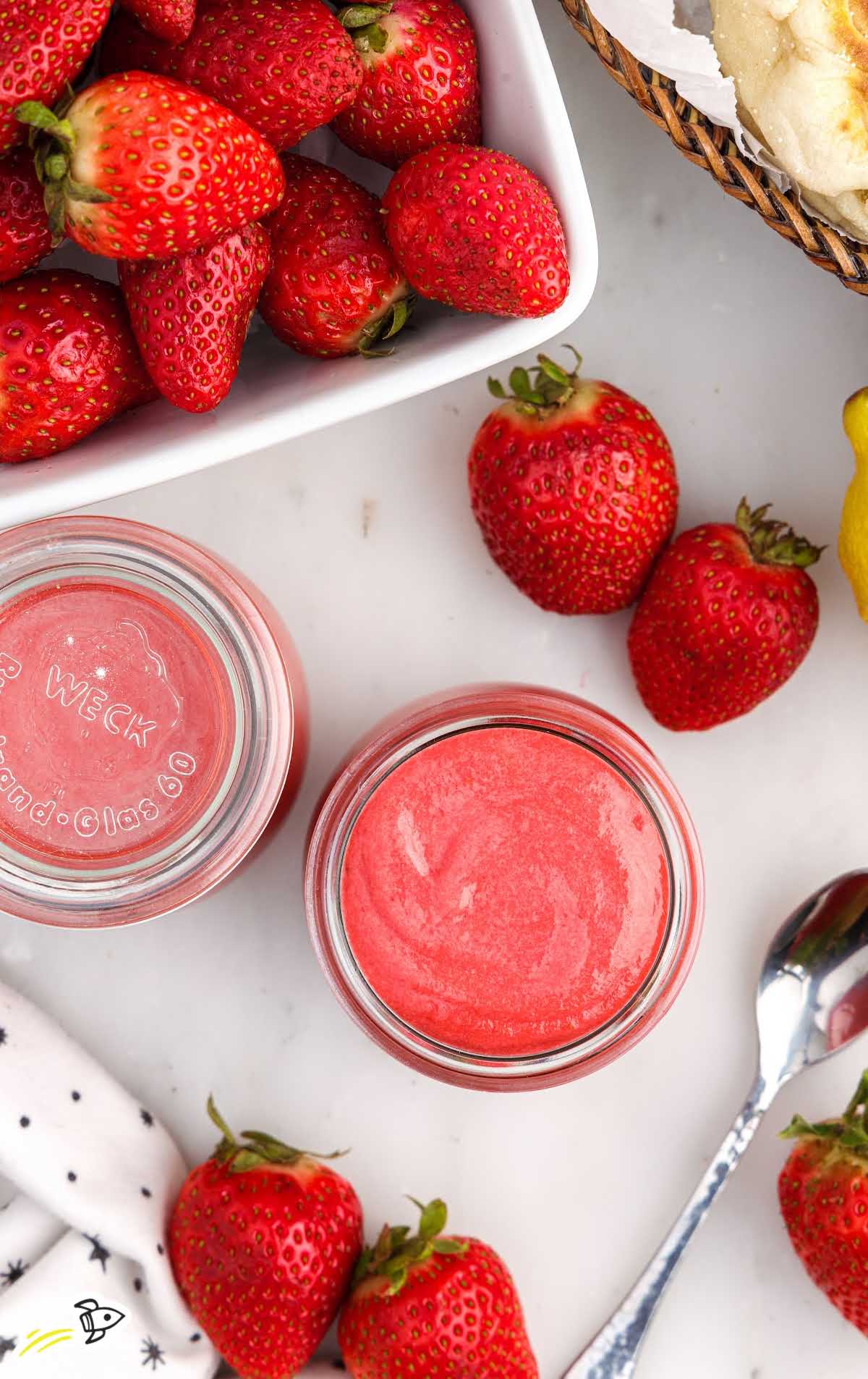 overhead shot of multiple Strawberry Curd in a glass cup