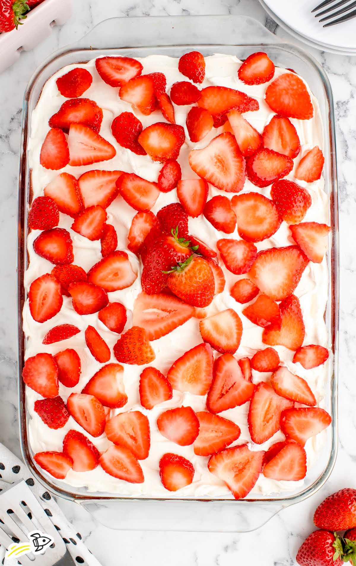 overhead shot of Strawberry Tres Leches Cake in a baking dish