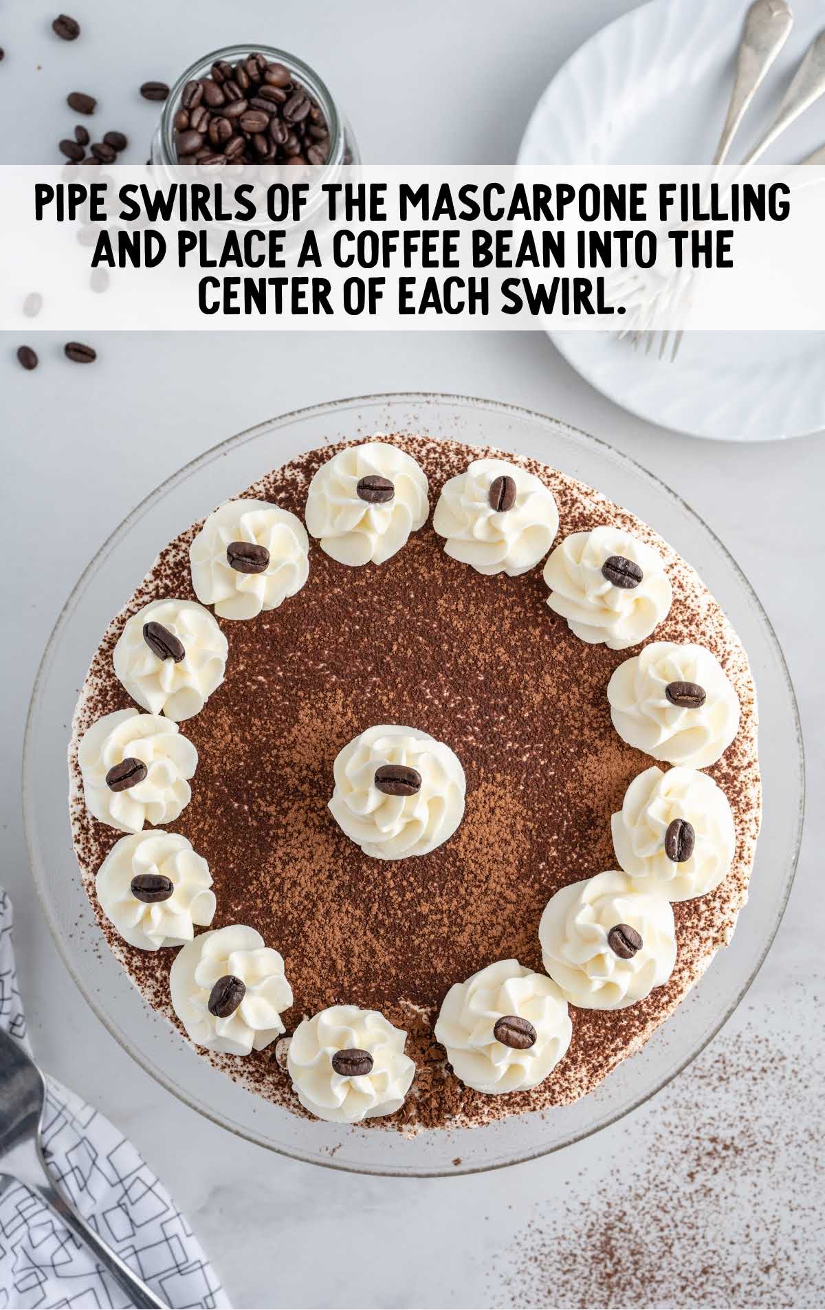 swirls of mascarpone filling piped and coffee bean placed into the center of each swirl