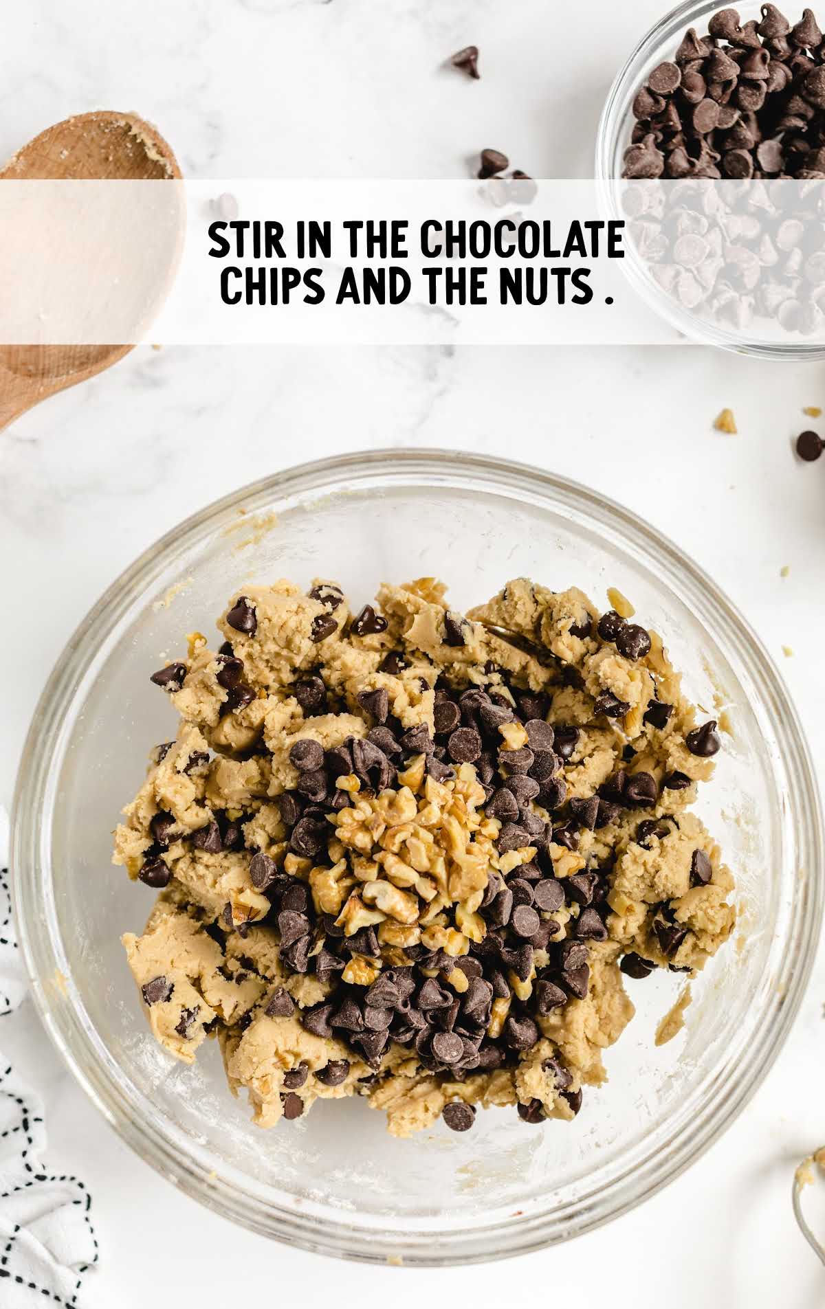 chocolate chips and nuts stirred in a bowl