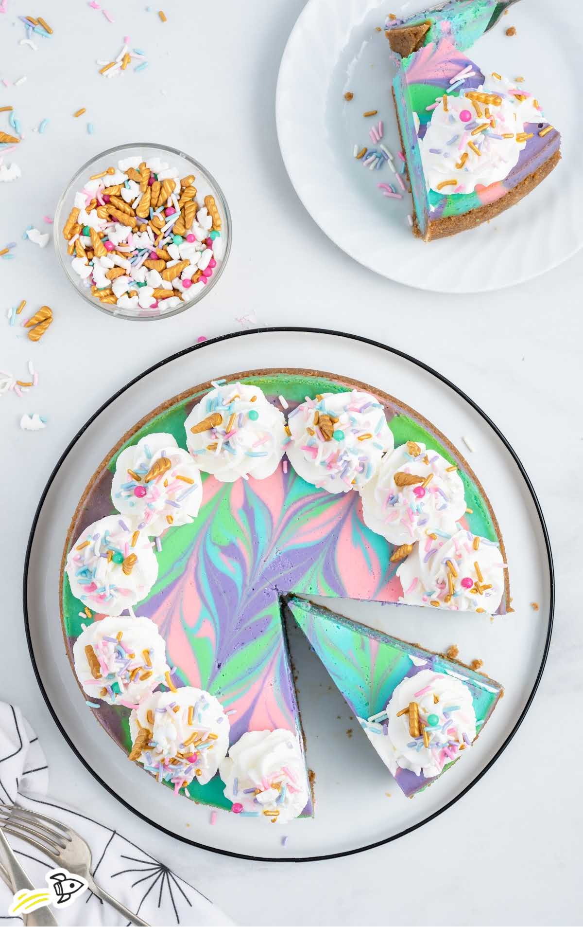 overhead shot of Unicorn Cheesecake with a slice taken out