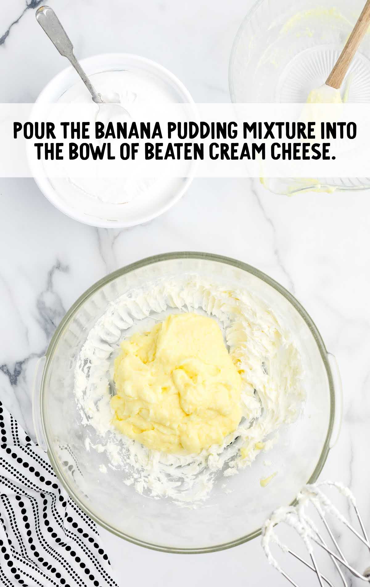 banana pudding mixture poured into the cream cheese
