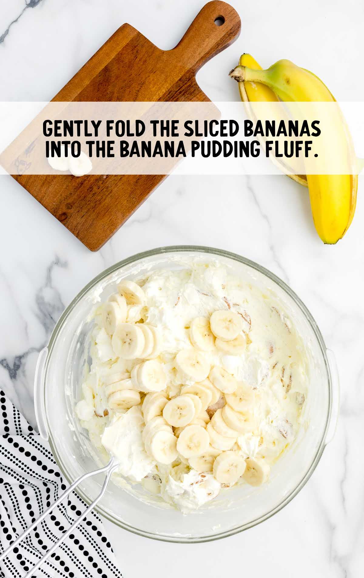 sliced bananas folded into the banana pudding fluff