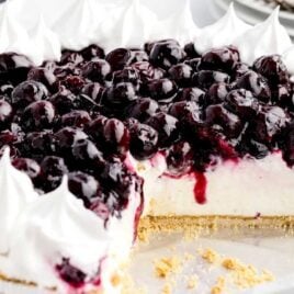 a close up shot of Blueberry Cream Cheese Pie with a slice taken out