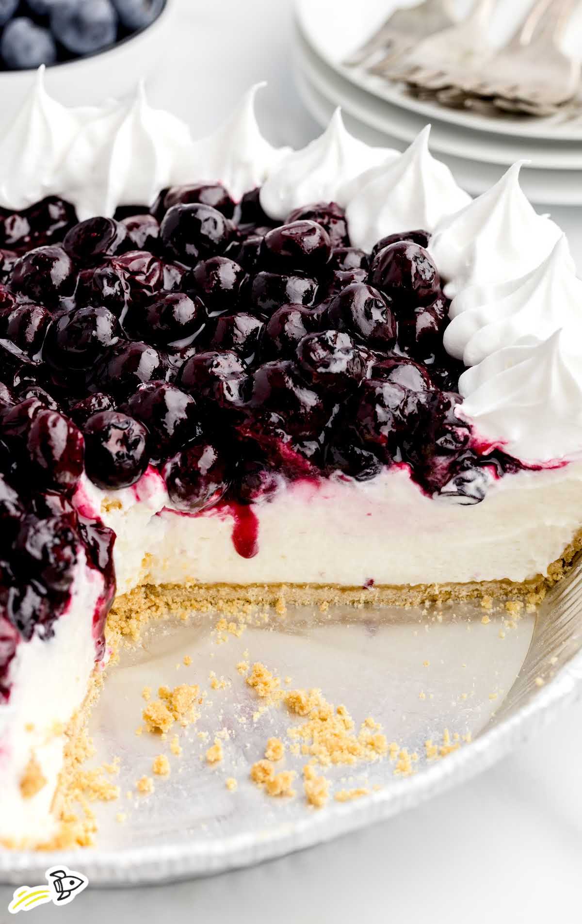 a close up shot of Blueberry Cream Cheese Pie with a slice taken out