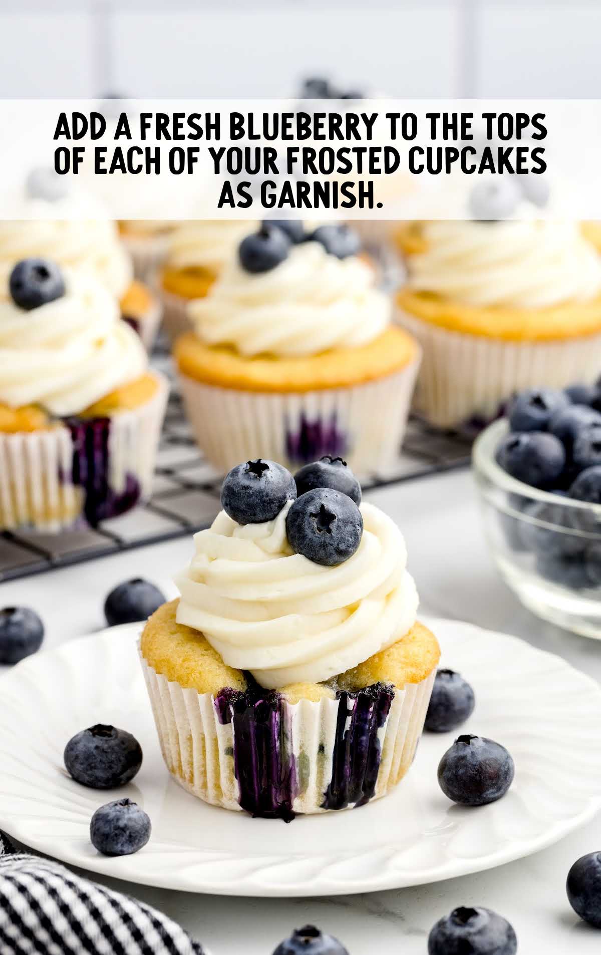 blueberry added to the top of each cupcake