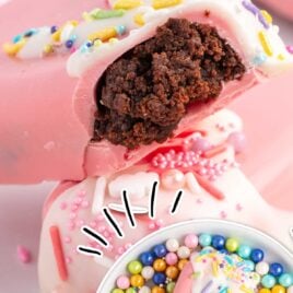 a close up shot of a Cakesicle with a bite taken out of it and overhead shot of Cakesicle in a bowl of candy