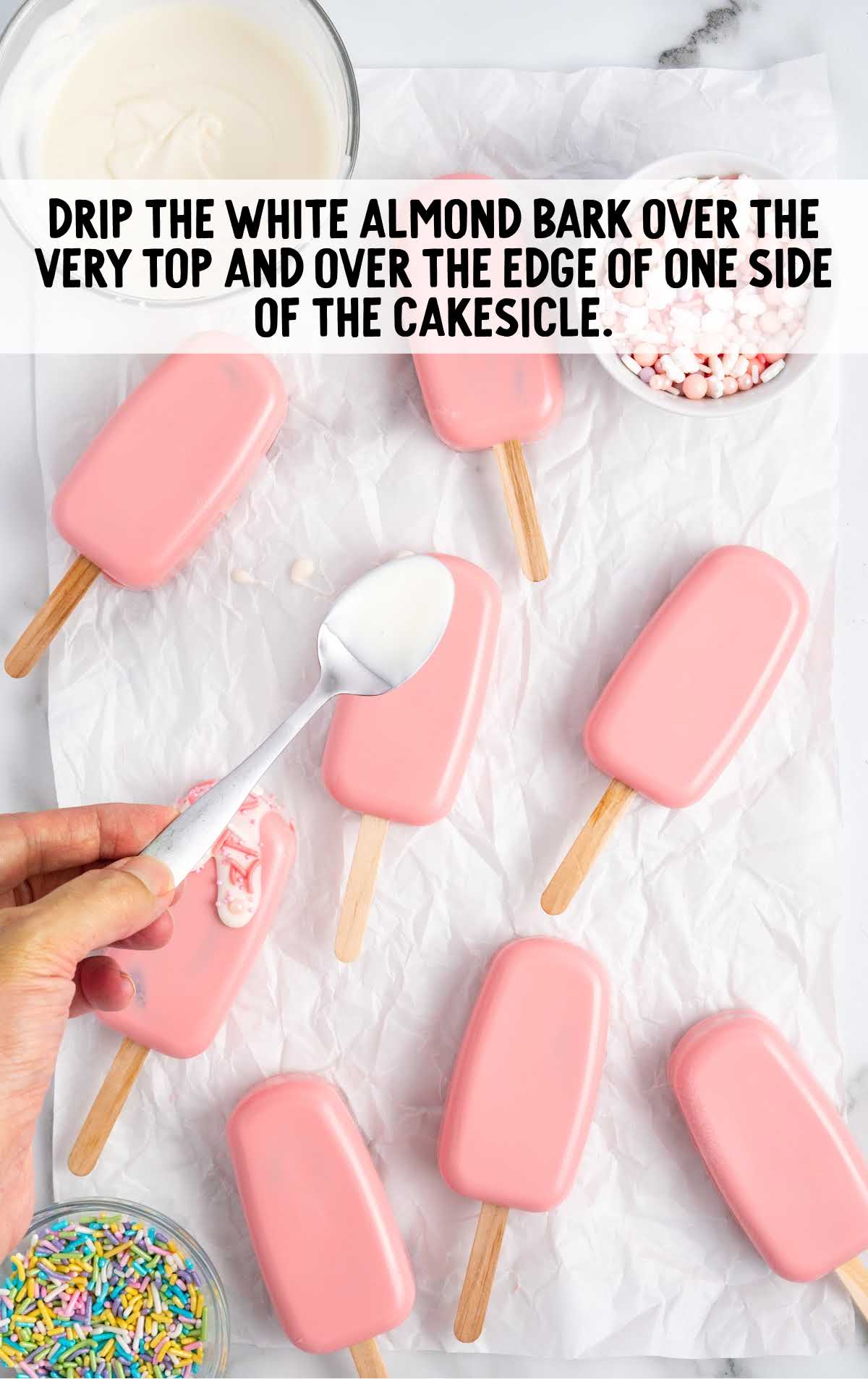 white almond bark dripped over the top and edges of cakesicle
