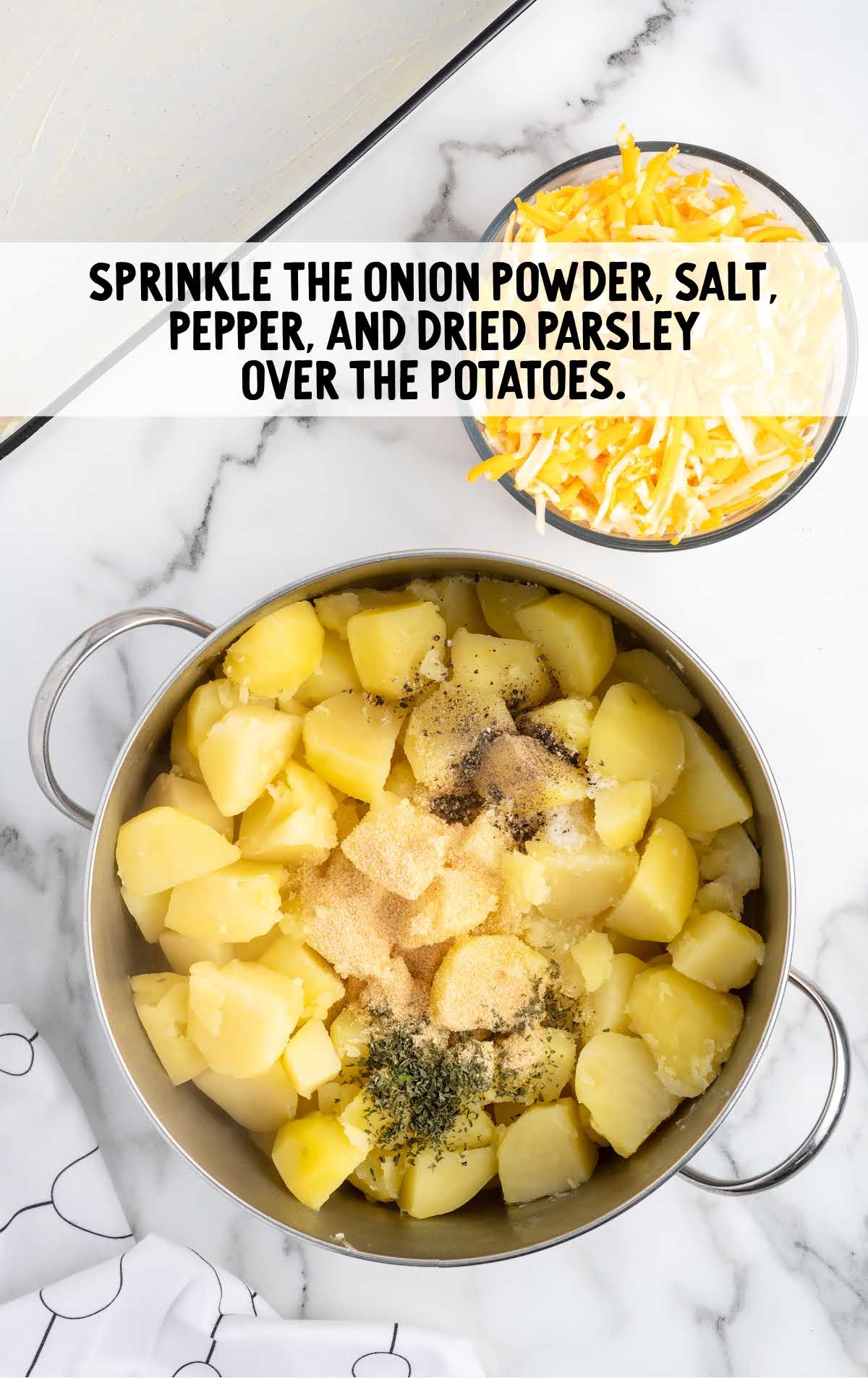 onion powder, salt, pepper, and dried parsley sprinkled over the potatoes