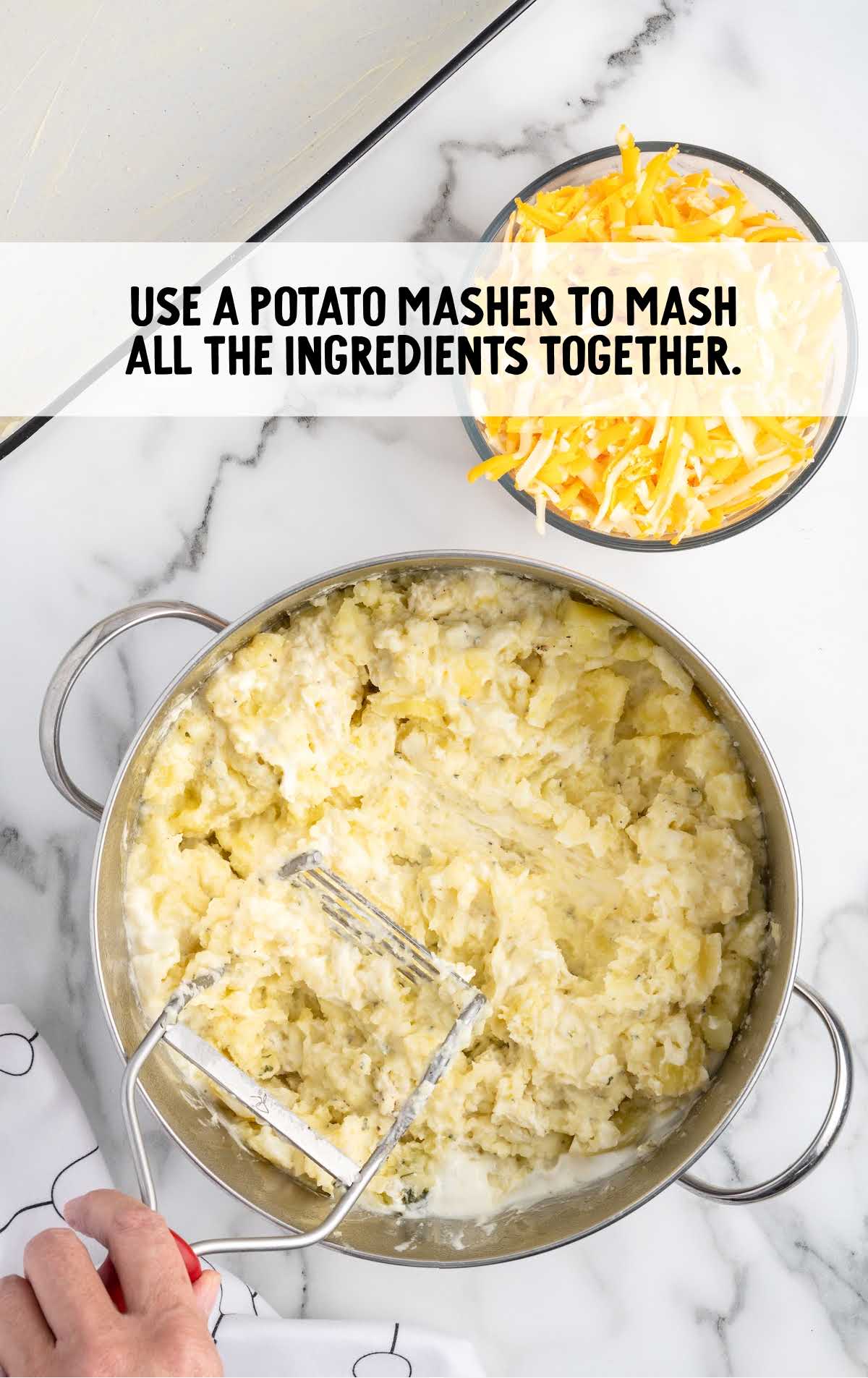 potato masher used to mash ingredients together