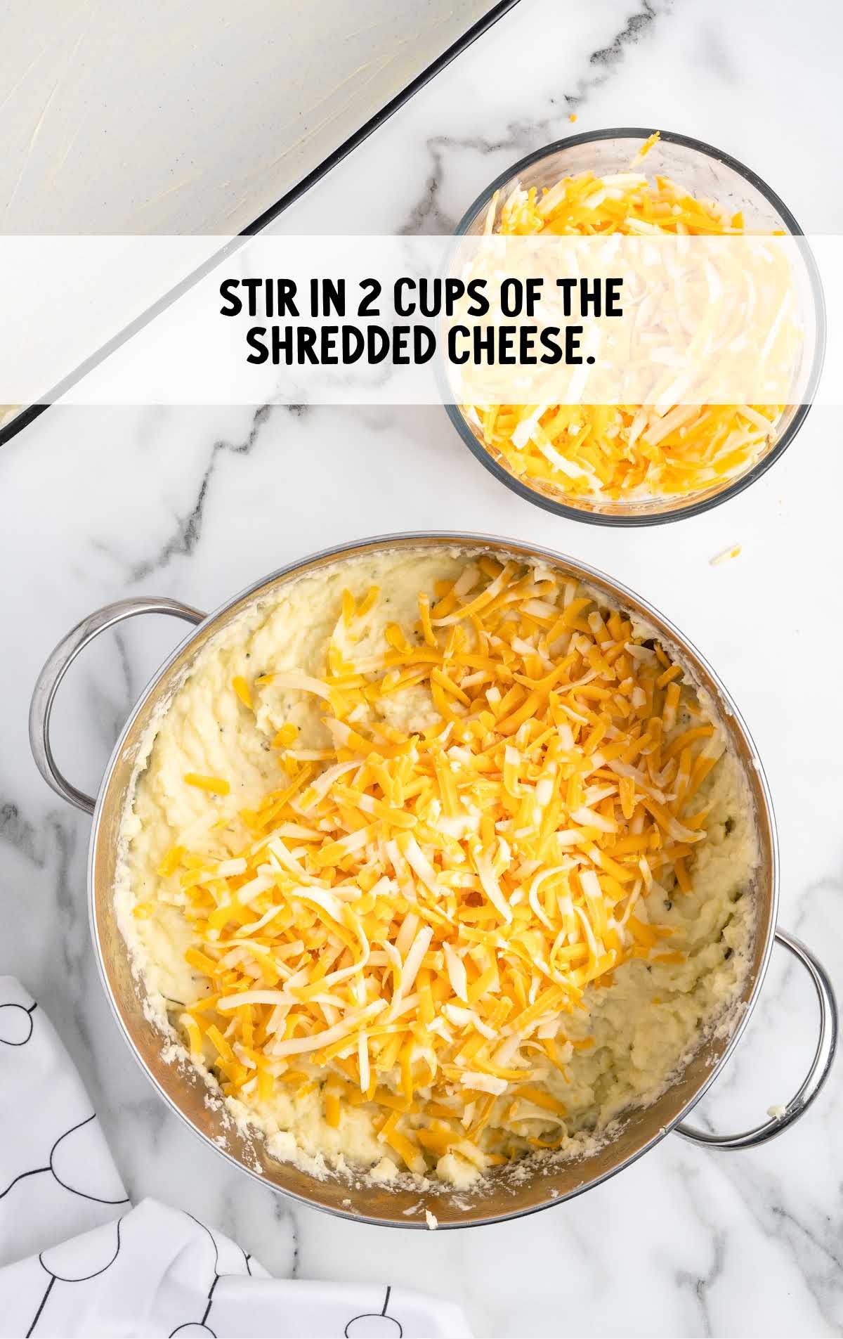 shredded cheese stirred in a pot