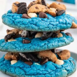 a close up shot of Cookie Monster Cookies stacked on top of each other