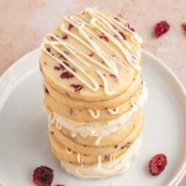 close up shot of Cranberry Orange Cookies stacked on top of each other