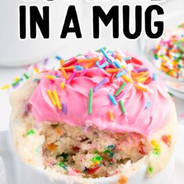 a close up shot of Cupcake in a Mug with a piece taken out