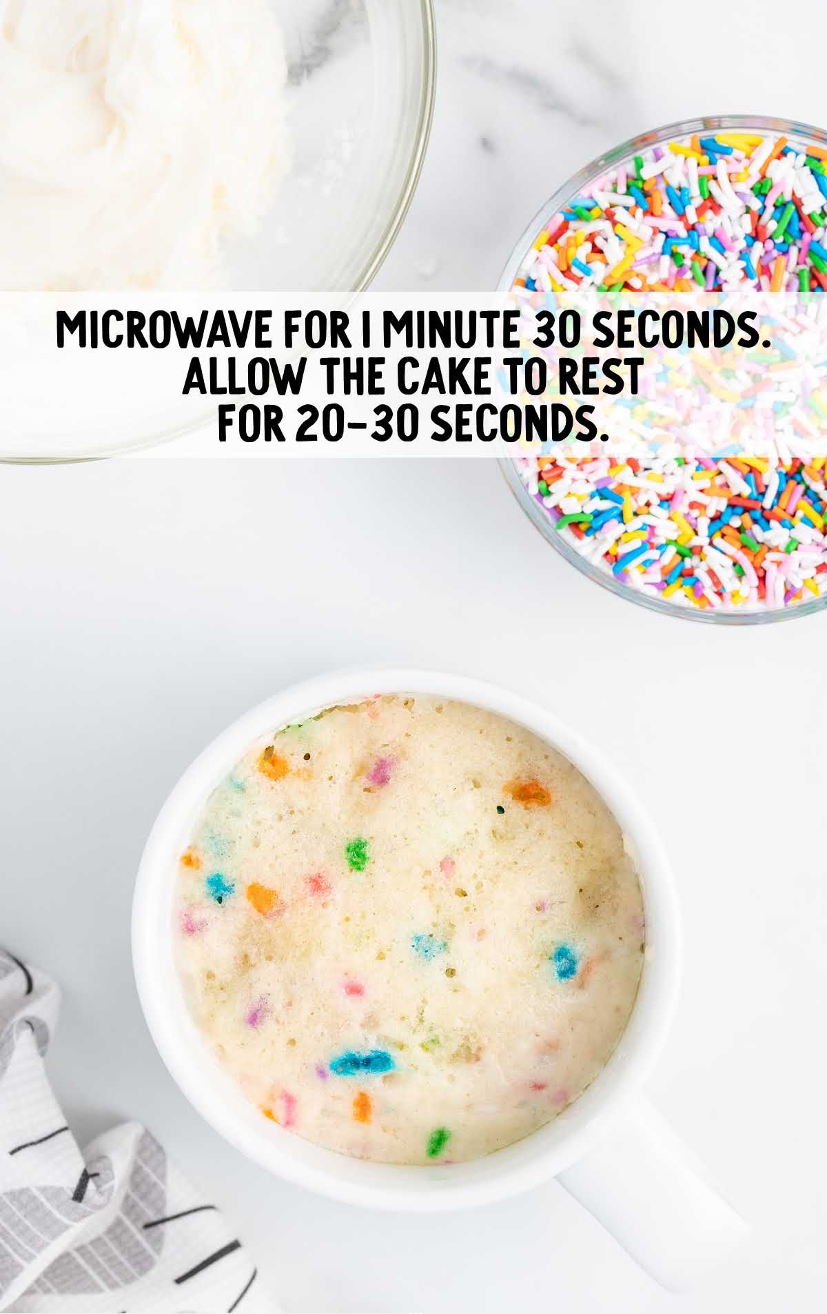 microwave the cupcake in a mug for 20-30 seconds
