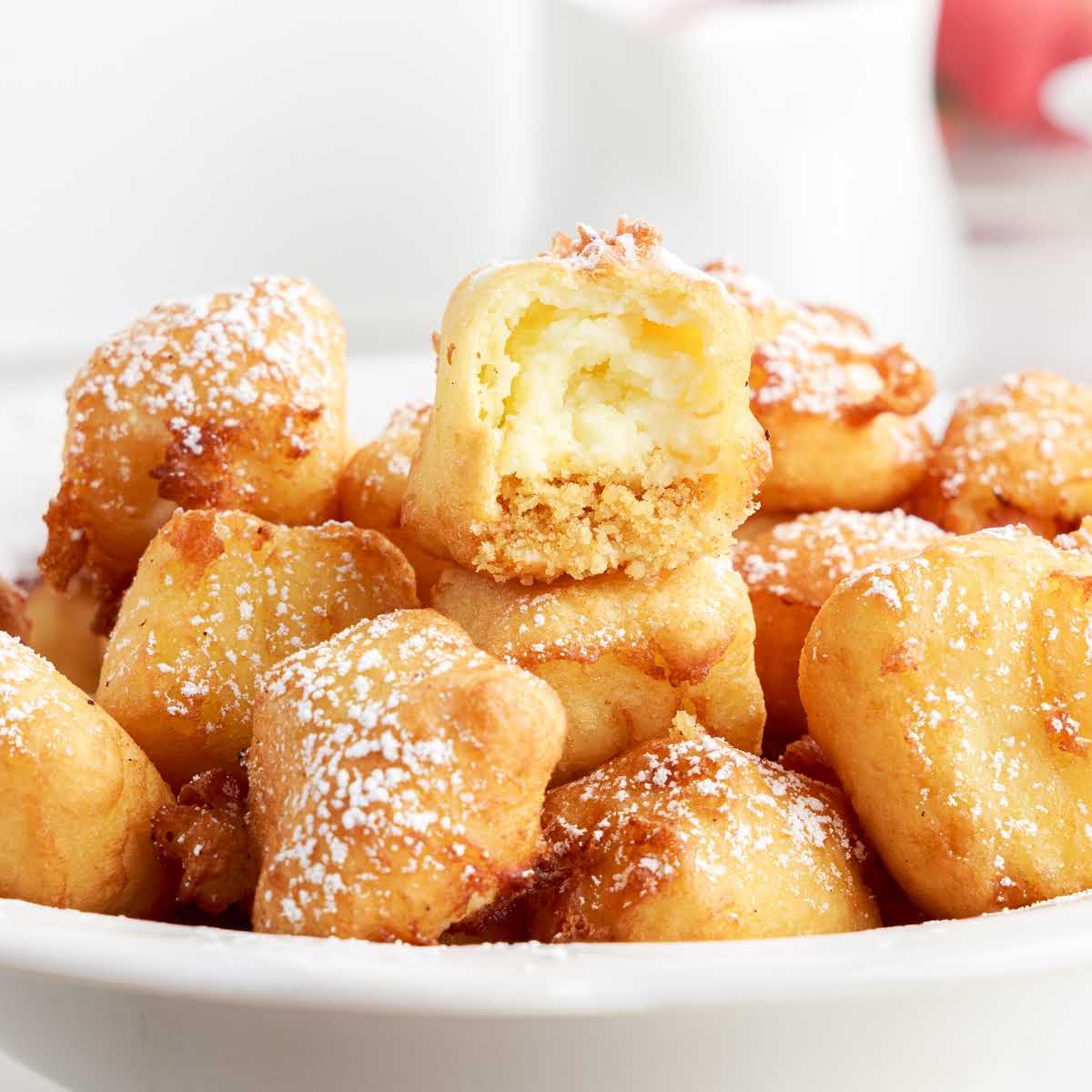 a close up shot of Fried Cheesecakes in a bowl