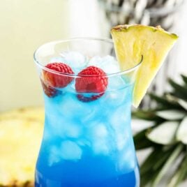 a close up shot of Fruit Tingle Cocktail in a tall glass