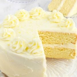 a close up shot of Lemon Cake with a slice taken out