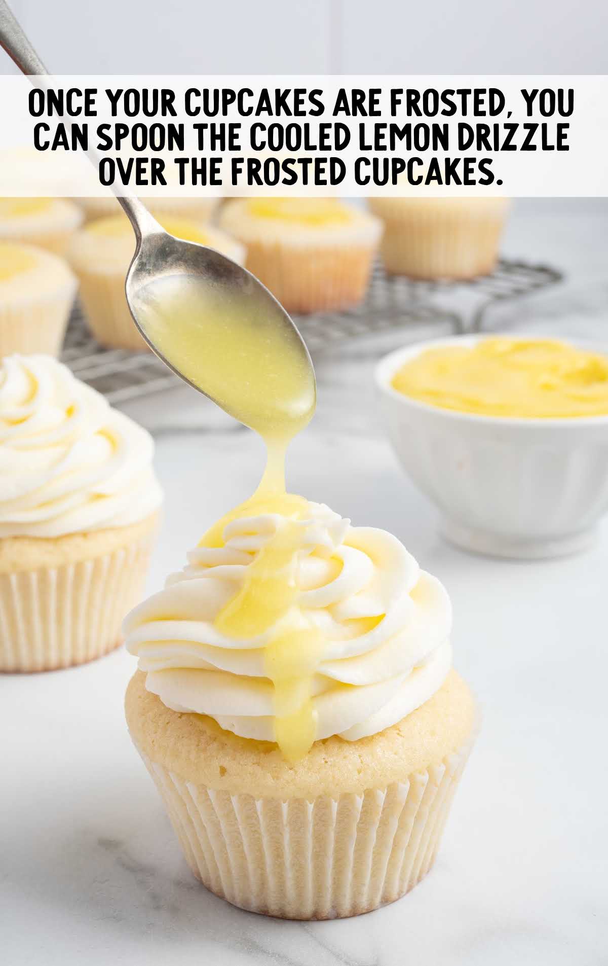 spoon the lemon drizzle over the frosted cupcake