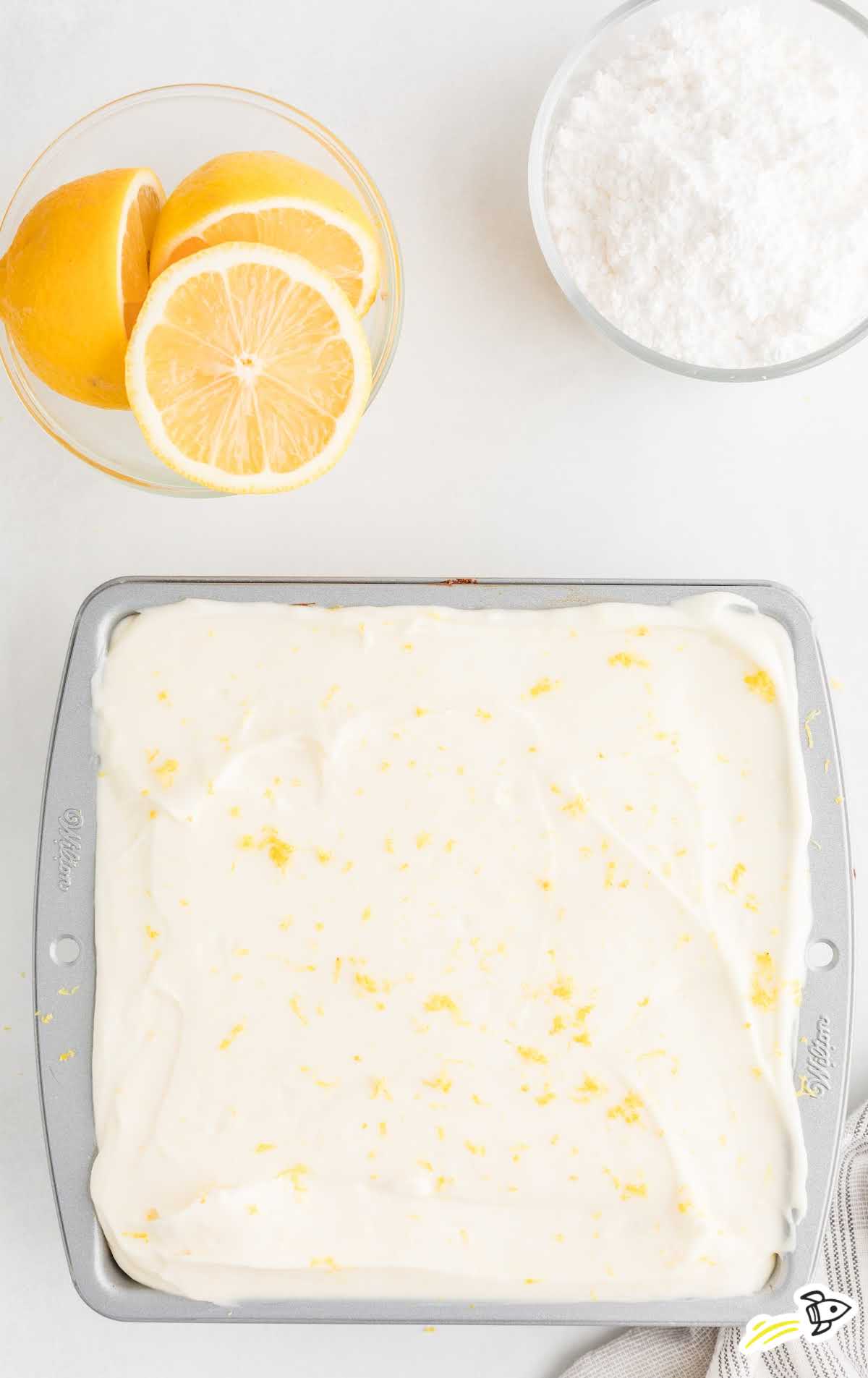 overhead shot of Lemon Sour Cream Cake on a baking dish