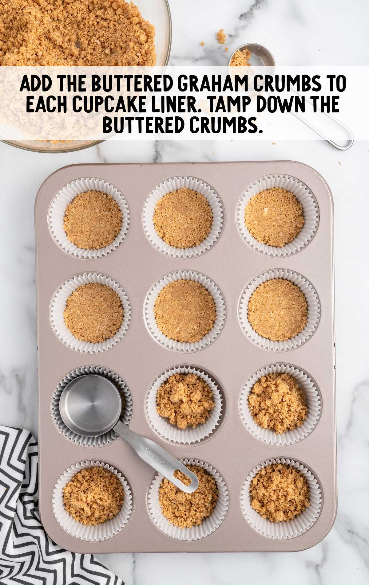 buttered graham crumbs added to each cupcake liner