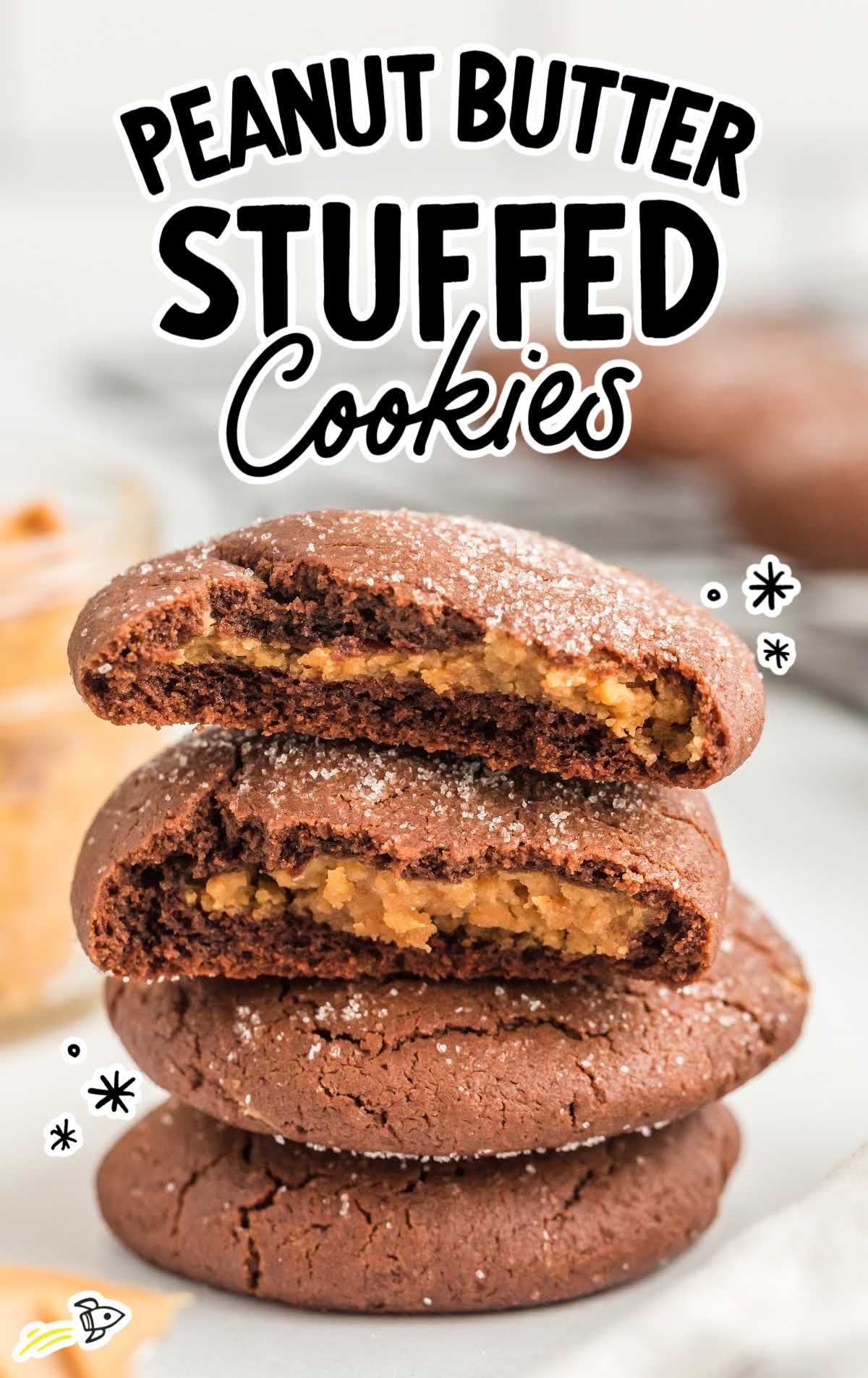 a close up shot of Peanut Butter Stuffed Cookies with one split in half stacked on top of each other