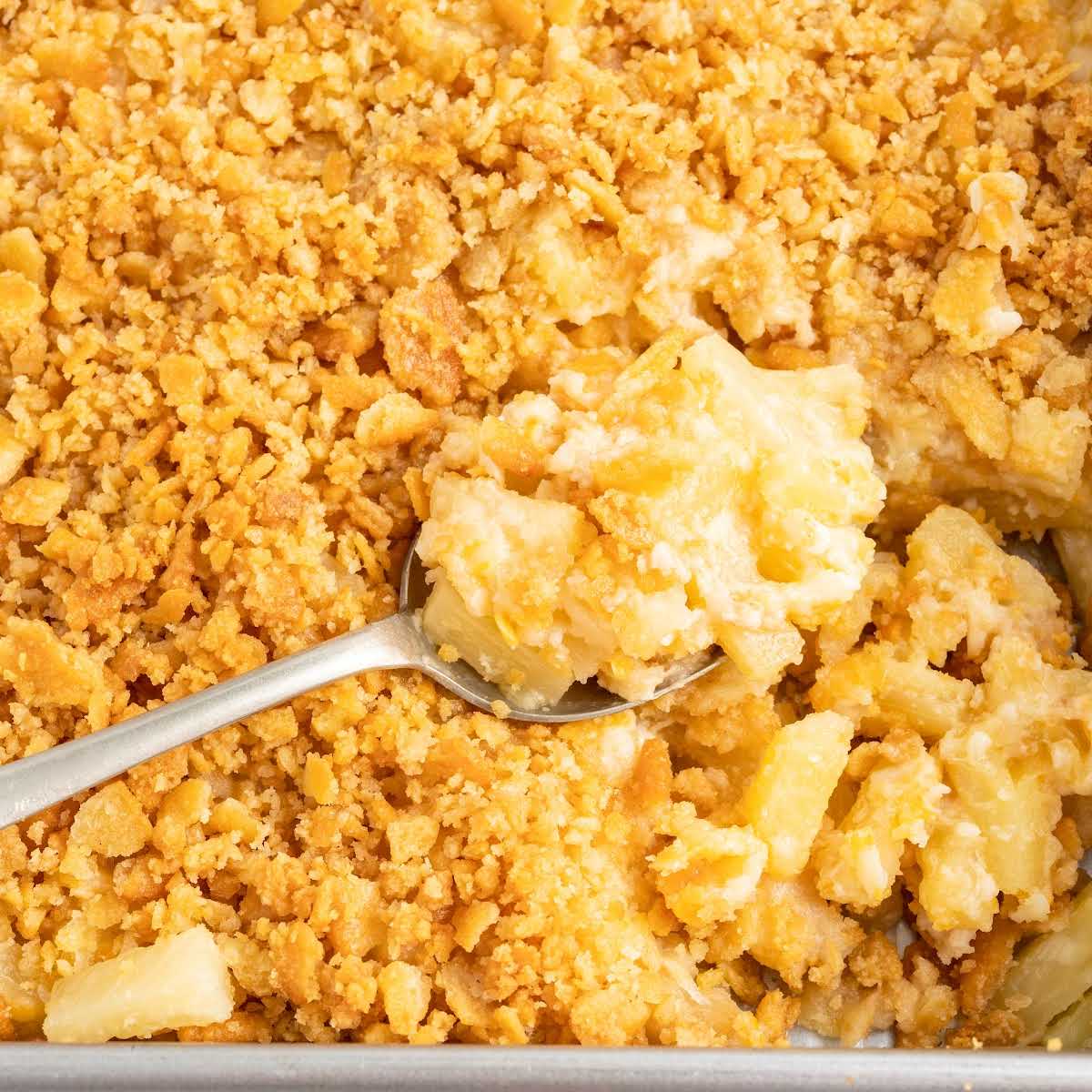 a close up shot of a spoonful of Pineapple Casserole