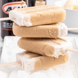 a close up shot of Root Beer Popsicles stacked on top of each other