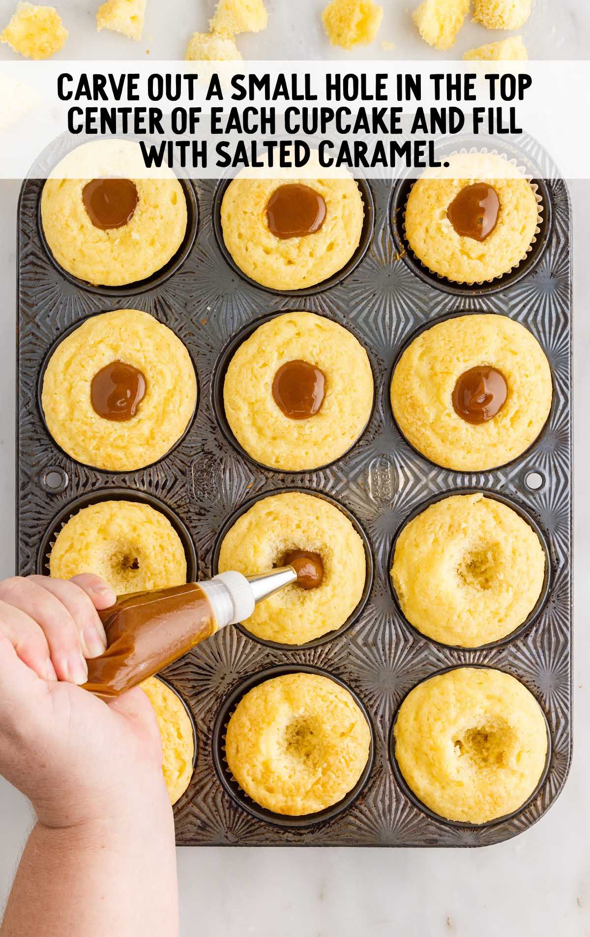 small hole caved out in the center of each cupcake and fill with salted caramel