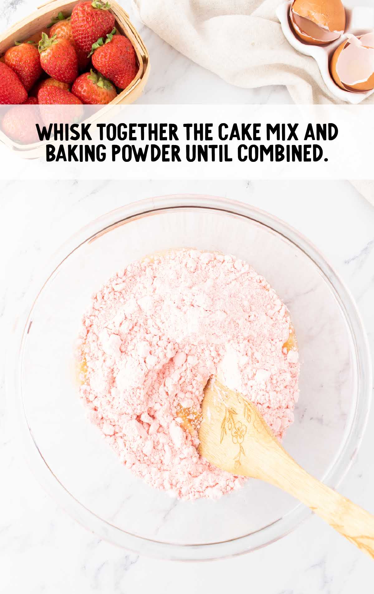 cake mix and baking powder whisked in a bowl